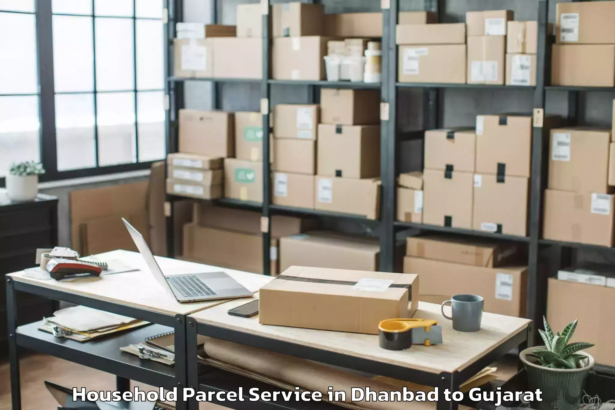 Dhanbad to Mendarda Household Parcel Booking